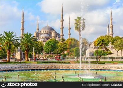 The Blue Mosque and the fountain in Sultan Ahmet park, Istanbul, Turkey.. The Blue Mosque and the fountain in Sultan Ahmet park, Istanbul, Turkey