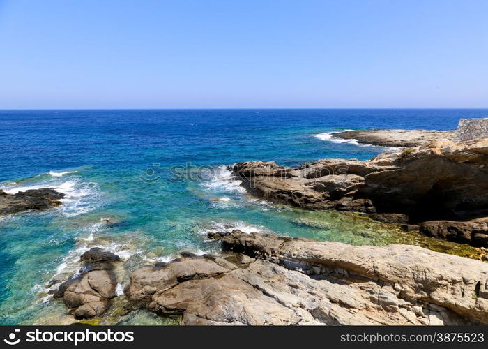 The blue see and rocks of Apollonas in Naxos