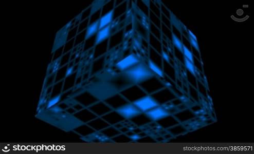 The blue shone cube rotates against a dark background