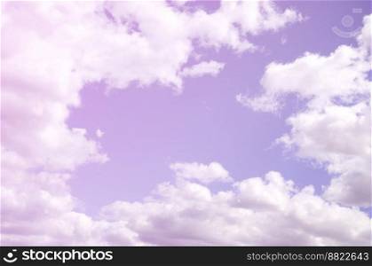 The blue sky with a lot of white clouds of different sizes, forming a frame around the cloudless area. The blue sky with a lot of white clouds of different sizes, form
