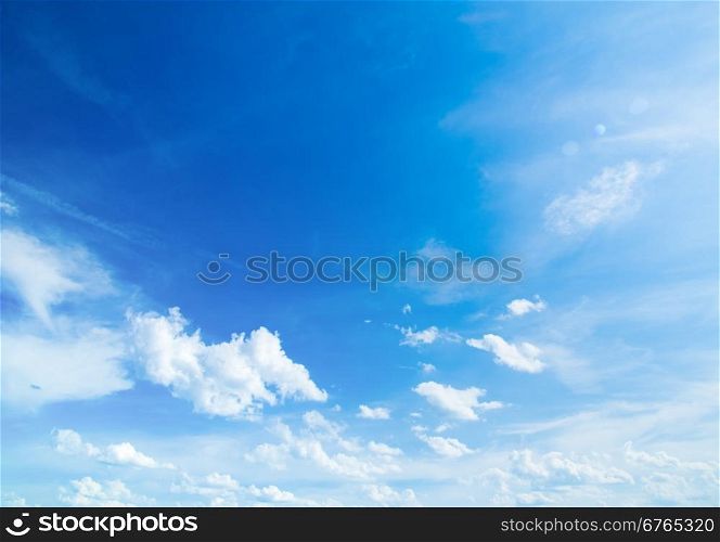 The blue sky with clouds, background