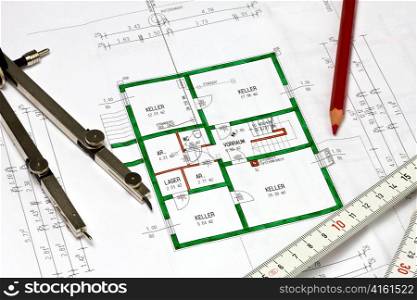 the blueprint of a house with a compass and ruler