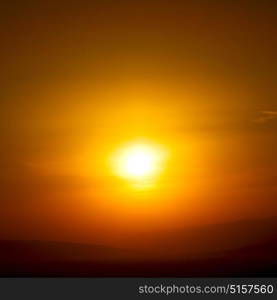 the blurred sun falling down arabian mountain in oman