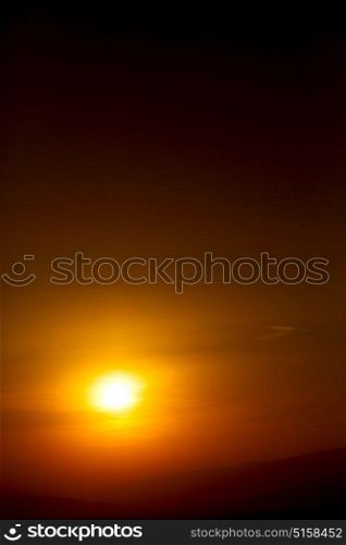 the blurred sun falling down arabian mountain in oman