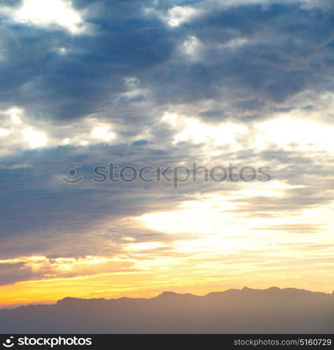 the blurred sun falling down arabian mountain in oman