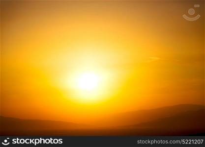 the blurred sun falling down arabian mountain in oman