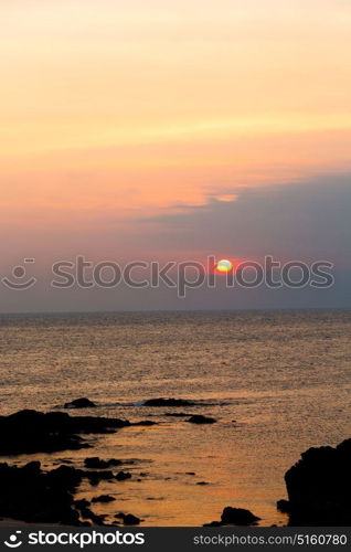 the blurred sun falling down arabian sea ocean in oman coastline