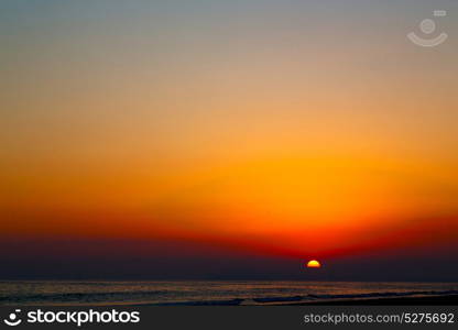 the blurred sun falling down arabian sea ocean in oman coastline