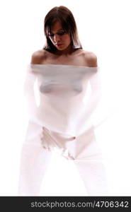 The body of a beautiful naked woman through the transparent fabric on a white background