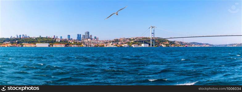The Boshporus, the 15 July Martyrs Bridge and european bank of Istanbul with the Ortakoy Mosque, Istanbul panorama.. The Boshporus, the 15 July Martyrs Bridge and european bank of Istanbul with the Ortakoy Mosque, Istanbul panorama