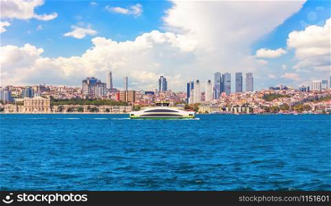 The Bosphorus straight view, the Dolmabahce palace and Besiktas skyscrappers in the background, Istanbuil, Turkey.