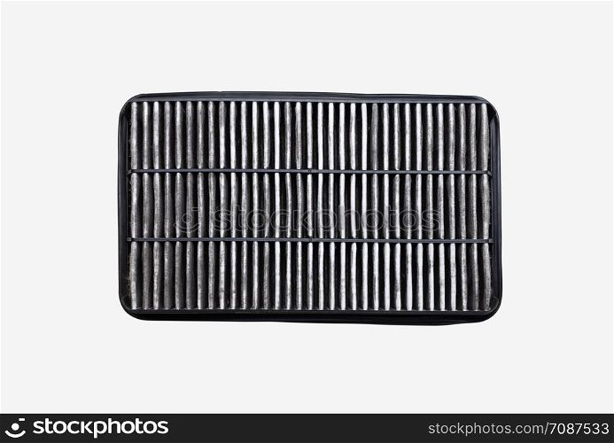 The bottom side of the dirty car air filter with dust isolated on white background with clipping path. Automotive services maintenance.