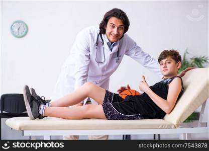 The boy basketball player visiting young doctor traumatologist. Boy basketball player visiting young doctor traumatologist