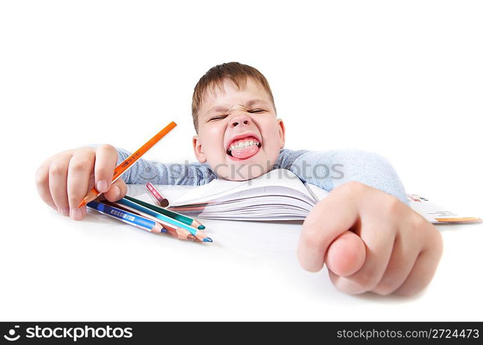 The boy with the book behind a table on a white background