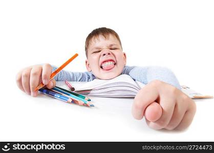 The boy with the book behind a table on a white background