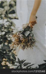 The bride and the flowers in her hand