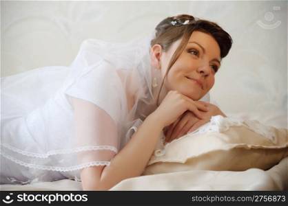 The bride. The young girl in a wedding dress on an abstract background