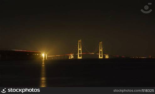The bridge across the Great Belt - the Storebaelt Bridge in Denmark, night time.. Storebaelt Bridge in Denmark at night