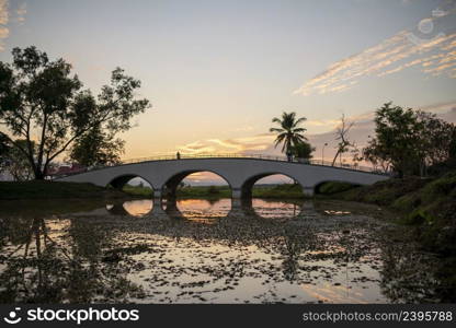 The bridge in the park to watch the sunset at Ban Tharae Sakon Nakhon, Thailand.