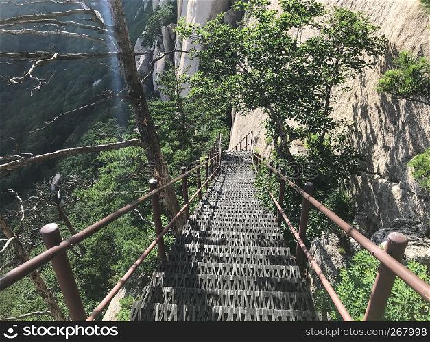 The bridge with steps leading down from the mountain peak. Seoraksan National Park. South Korea