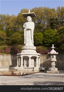 The Buddha in the main courtyard of Beongeunsa Temple in Seoul, South Korea stands roughly 40-50 feet tall.
