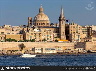 The building of the dome and bell tower of St. Paul&rsquo;s Cathedral on a sunny day. Valletta. Malta.. Valletta. The building of the Cathedral of St. Paul on a sunny day.
