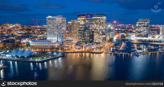 The buildings are illuminated in the downtown urban core of Baltimore Maryland