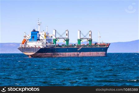 The bulk cargo ship to harbor quayside Vladivostok. bulk cargo ship to harbor quayside Vladivostok