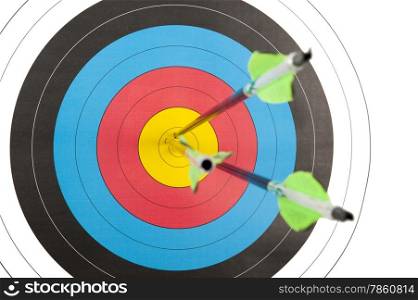 The bull&rsquo;s eye of an archery target with three arrows