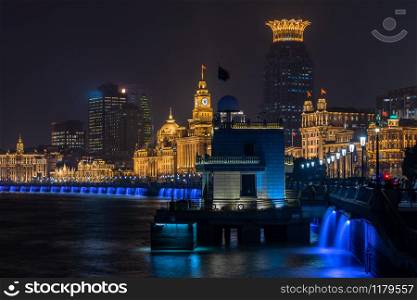 The Bund in Shanghai is a famous waterfront area in central Shanghai at night, China.