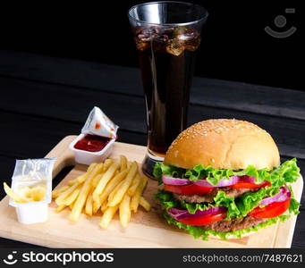 The burger served in bun in nutrition fast food concept. Burger served in bun in nutrition fast food concept