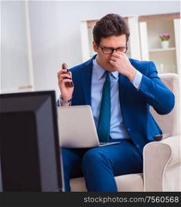 The businesman watching tv in office. Businesman watching tv in office