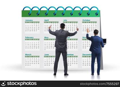 The business calendar concept with businessman. Business calendar concept with businessman