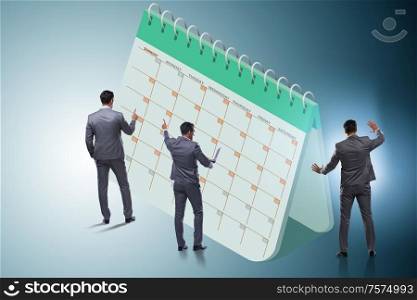The business calendar concept with businessman. Business calendar concept with businessman