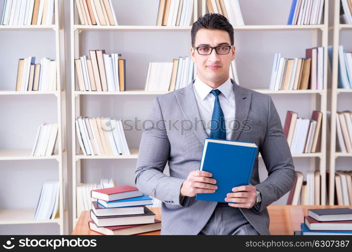 The business law student working studying in the library. Business law student working studying in the library