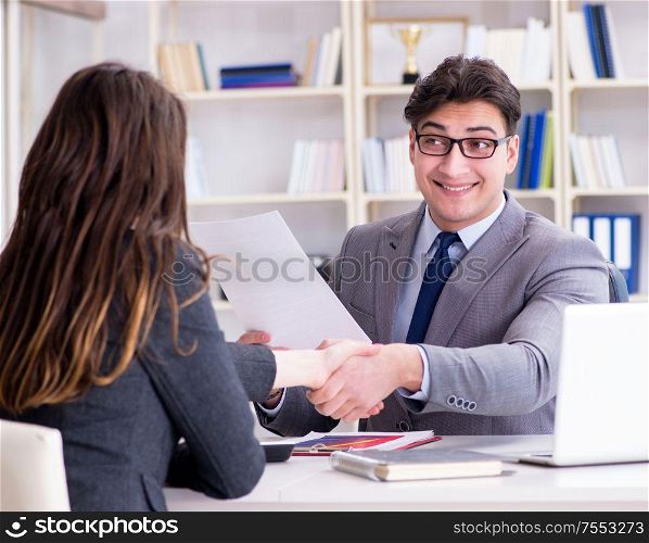 The business meeting between businessman and businesswoman. Business meeting between businessman and businesswoman
