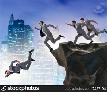 The business people falling off the cliff. Business people falling off the cliff