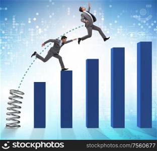 The business people jumping over bar charts. Business people jumping over bar charts