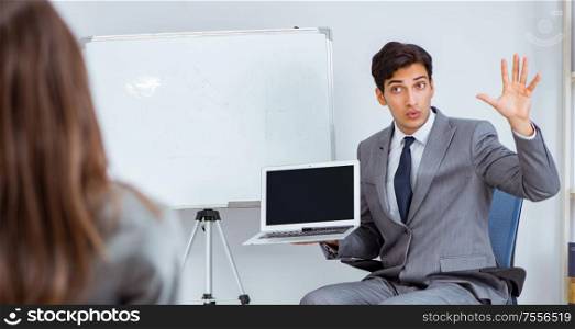 The business presentation in the office with man and woman. Business presentation in the office with man and woman