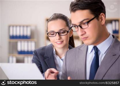 The businessman and businesswoman having discussion in office. Businessman and businesswoman having discussion in office