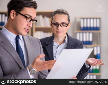 The businessman and businesswoman having discussion in office. Businessman and businesswoman having discussion in office