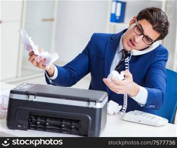 The businessman angry at copying machine jamming papers. Businessman angry at copying machine jamming papers