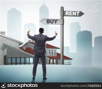 The businessman at crossroads betweem buying and renting. Businessman at crossroads betweem buying and renting