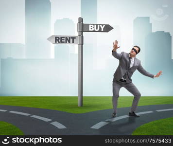 The businessman at crossroads betweem buying and renting. Businessman at crossroads betweem buying and renting