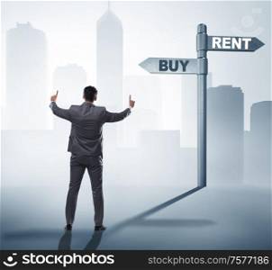 The businessman at crossroads betweem buying and renting. Businessman at crossroads betweem buying and renting
