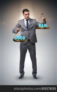 The businessman choosing between good and bad. Businessman choosing between good and bad. The businessman choosing between good and bad