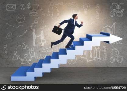 The businessman climbing career ladder in business concept. Businessman climbing career ladder in business concept. The businessman climbing career ladder in business concept