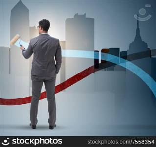 The businessman drawing charts in forecasting concept. Businessman drawing charts in forecasting concept