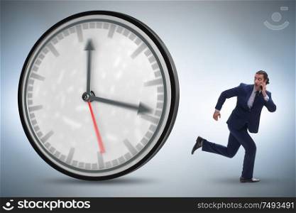 The businessman employee in time management concept. Businessman employee in time management concept