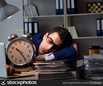 The businessman falling asleep during long hours in office. Businessman falling asleep during long hours in office